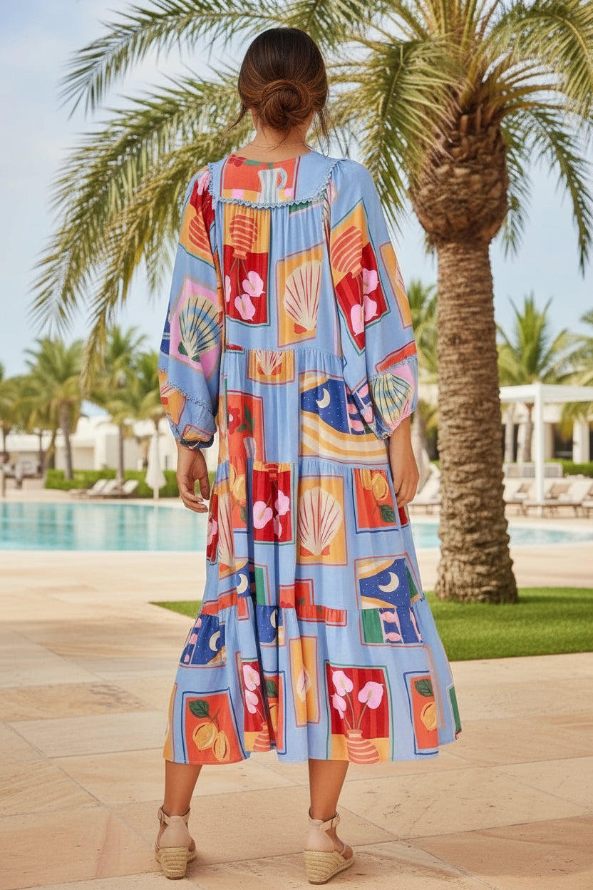 Woman wearing a colorful dress with a palm tree and pool in the background