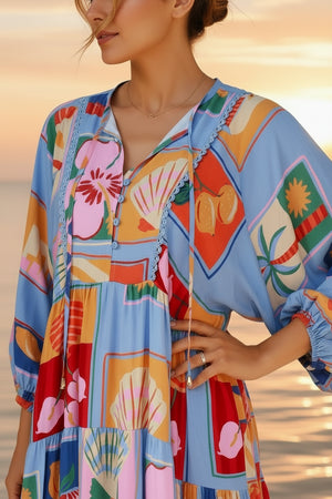 Colorful patterned dress worn by a person with a sunset and water background