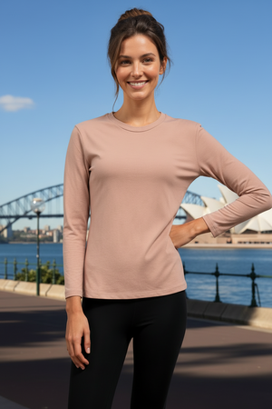 Woman wearing a pink long-sleeve top that's super soft