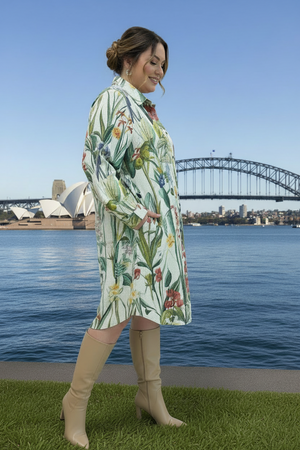 Woman in a floral corduroy shirt dress with Sydney harbour bridge and Opera House in the background