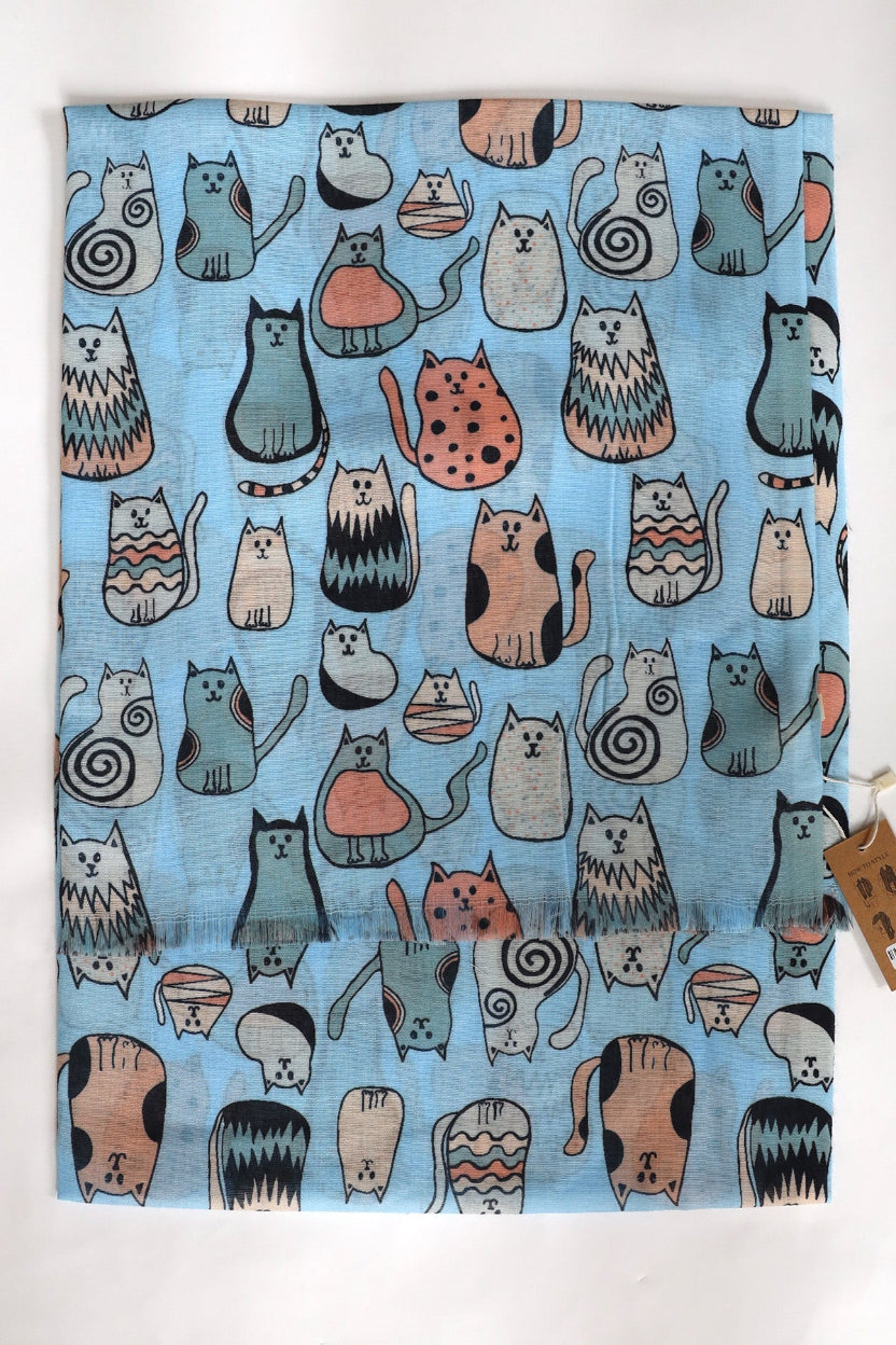Fabric with cat pattern on a blue background