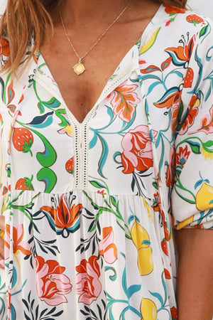 Colorful floral dress with a white background