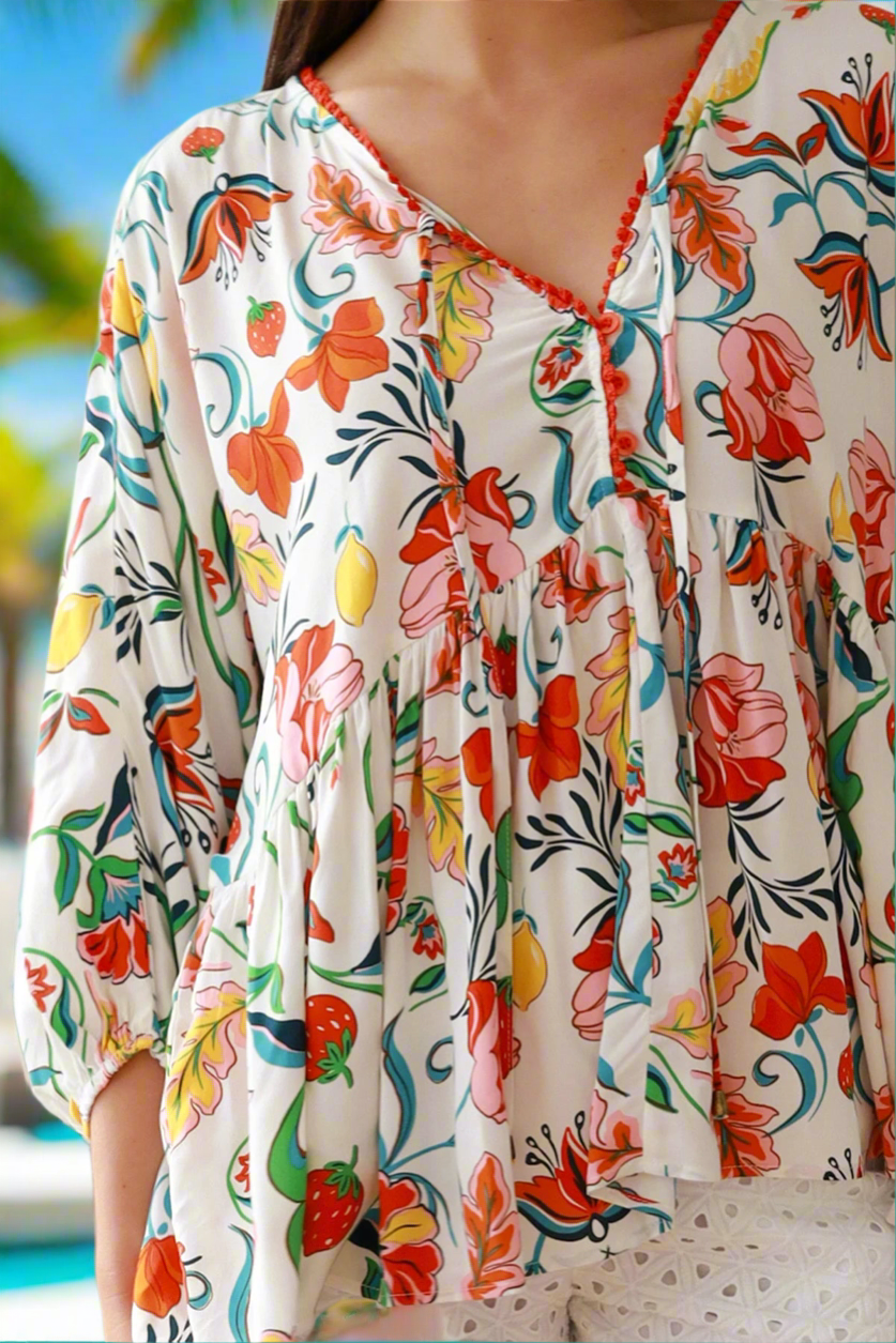 Colorful floral-patterned outfit with a blurred background