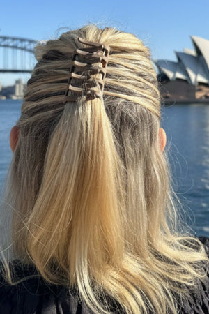 Person with blonde hair styled with a Claw Combo Hair Pin
