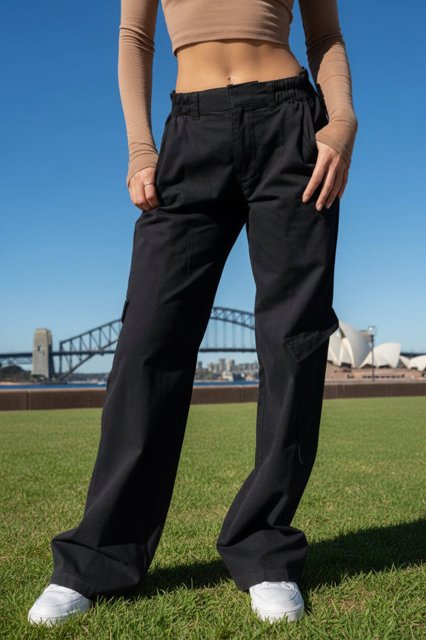Person wearing black cotton cargo pants 