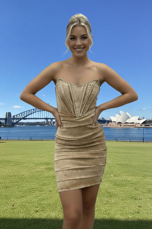 Woman in a beige denim corset dress 
