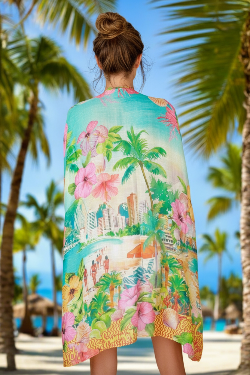 Woman wearing a colorful tropical print dress on a beach with palm trees in the background