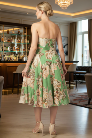 Woman in a floral dress standing in an elegant indoor setting