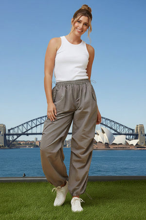 Woman in white top and beige cargo pants 
