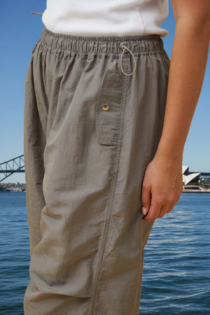 Person wearing gray cargo pants