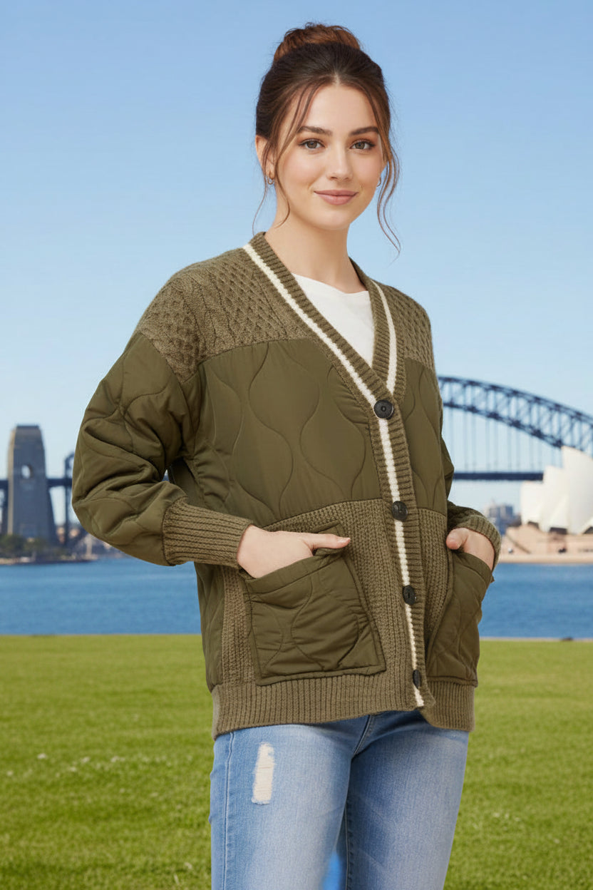 Woman wearing a button down green quilted jacket, with front pockets