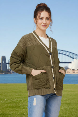 Woman wearing a button down green quilted jacket, with front pockets
