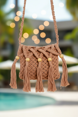 Woman in a colorful dress holding a woven bag with a pool and palm trees in the background