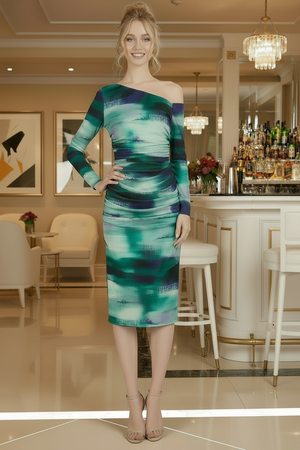 Woman wearing a green and blue one-shoulder dress in an elegant indoor setting.