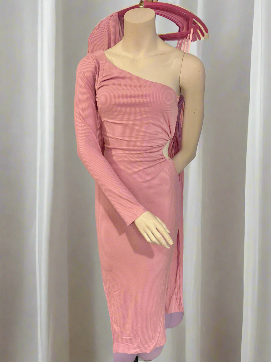 Girl wearing a pink one-shoulder dress against a white curtain background