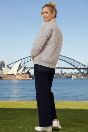 Woman wearing a grey quilted jacket