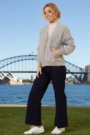 Woman wearing a grey jacket