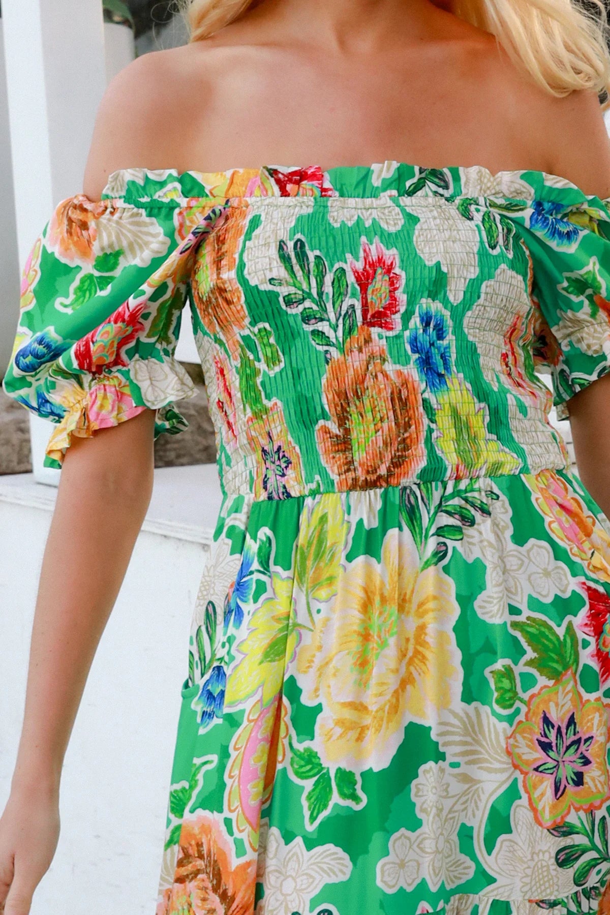 Colorful floral dress with green background