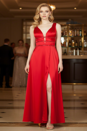 Woman wearing a red evening gown in an indoor setting with blurred background