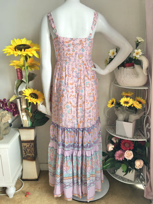 Boho Maxi Dress in Pink Print. This is a slightly larger cut. Consider one size smaller than your usual size, but take into consideration your bust size if larger than a C cup.